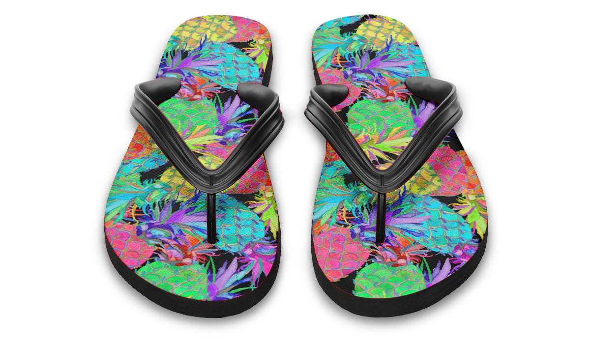 Colorful flip-flops with a tropical leaf pattern on a white background
