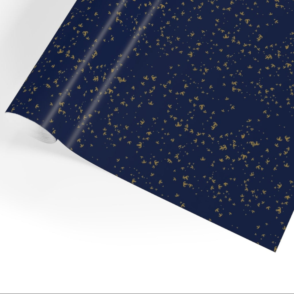 Roll of dark blue paper with gold speckles on a white background