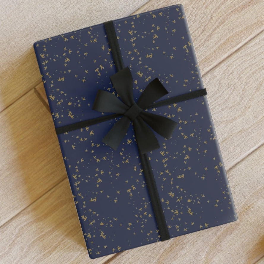 Blue gift box with black ribbon on a wooden floor
