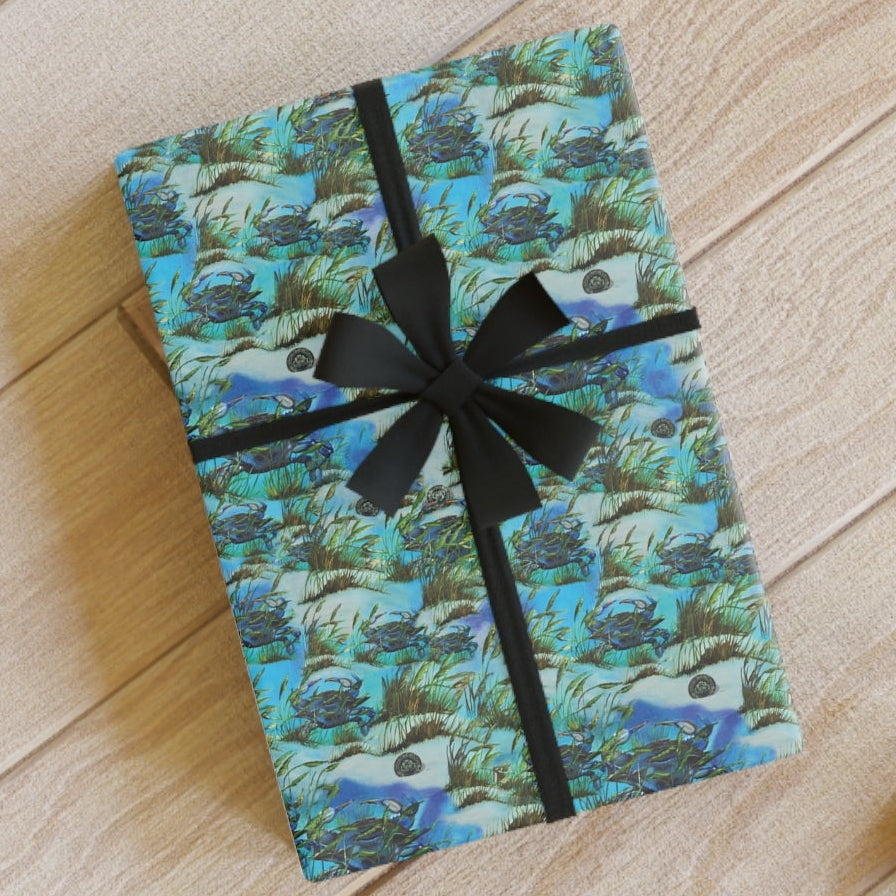 Gift box with green pattern and black ribbon on a wooden floor
