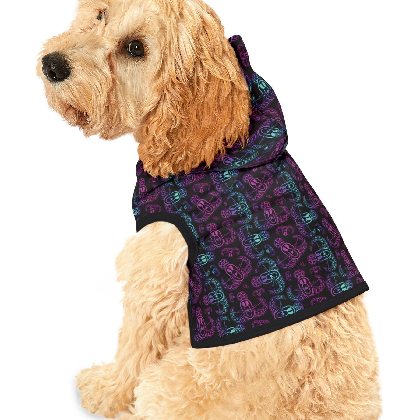 Dog wearing a purple patterned coat on a white background