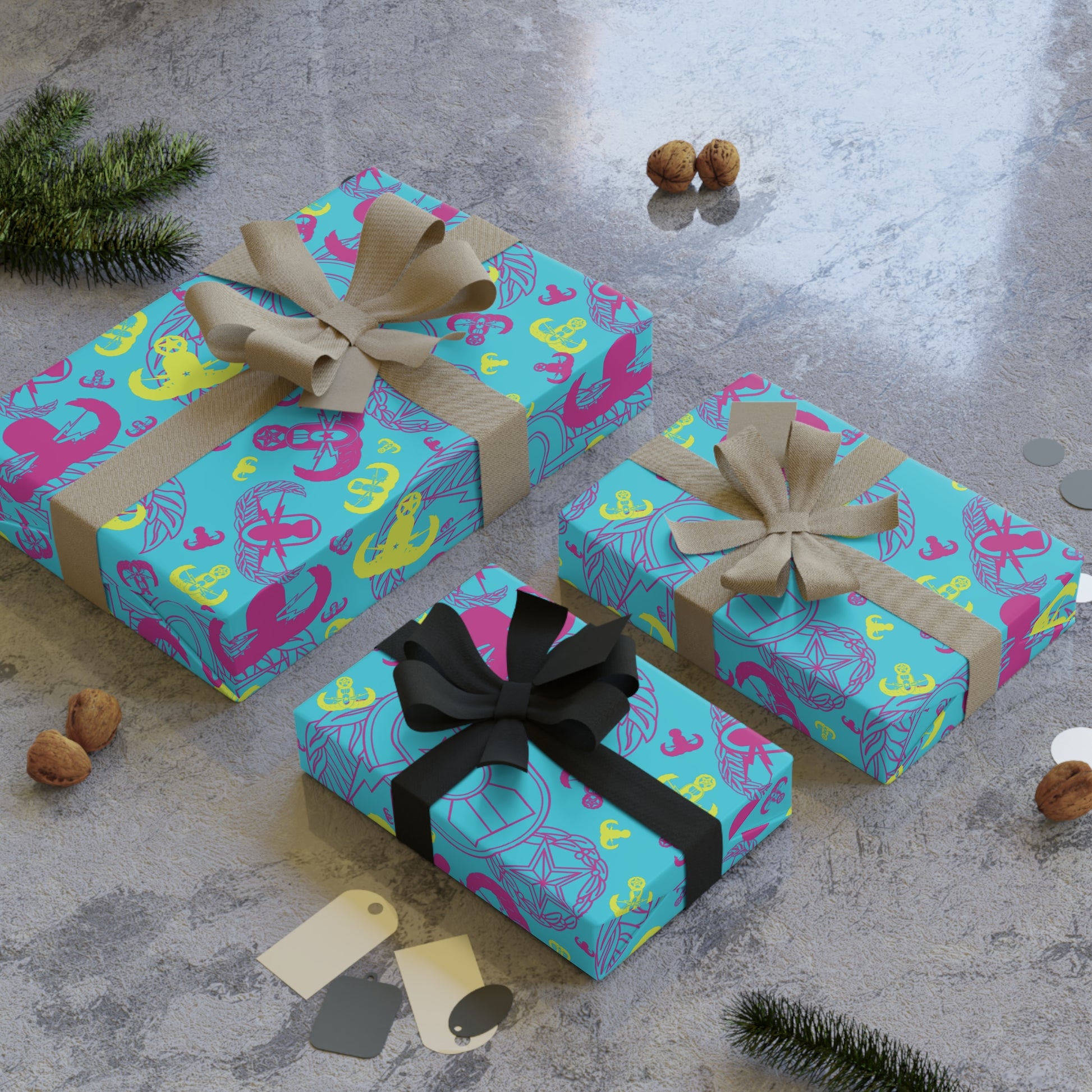 Three gift boxes with colorful patterns and ribbons on a textured surface.