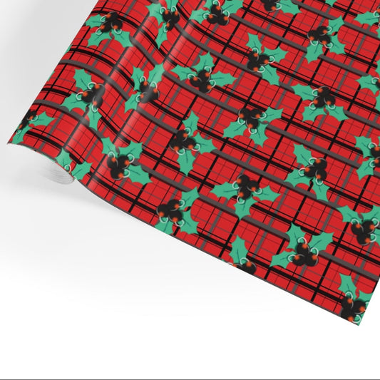 Red fabric with green holly pattern on a white background