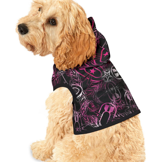 Dog wearing a black and pink patterned hoodie on a white background