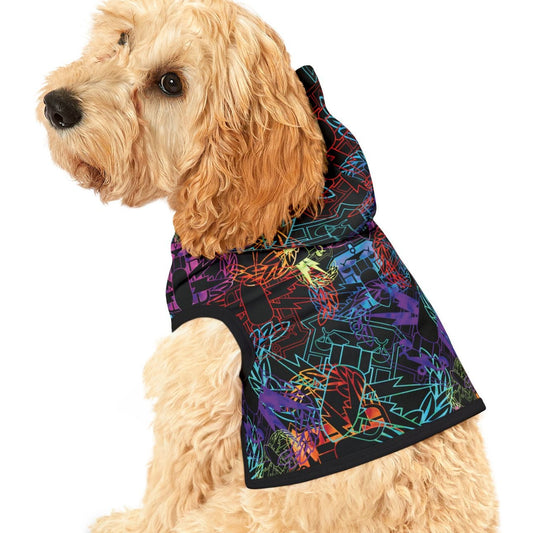 Dog wearing a colorful geometric-patterned coat on a white background