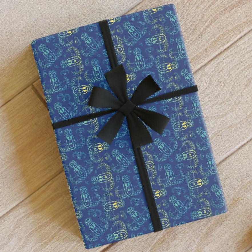 Blue gift box with black ribbon on a wooden floor